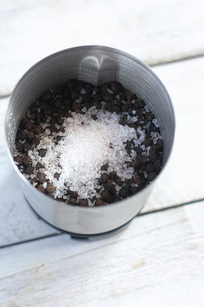 coarse kosher salt and whole black peppercorns in a spice grinder