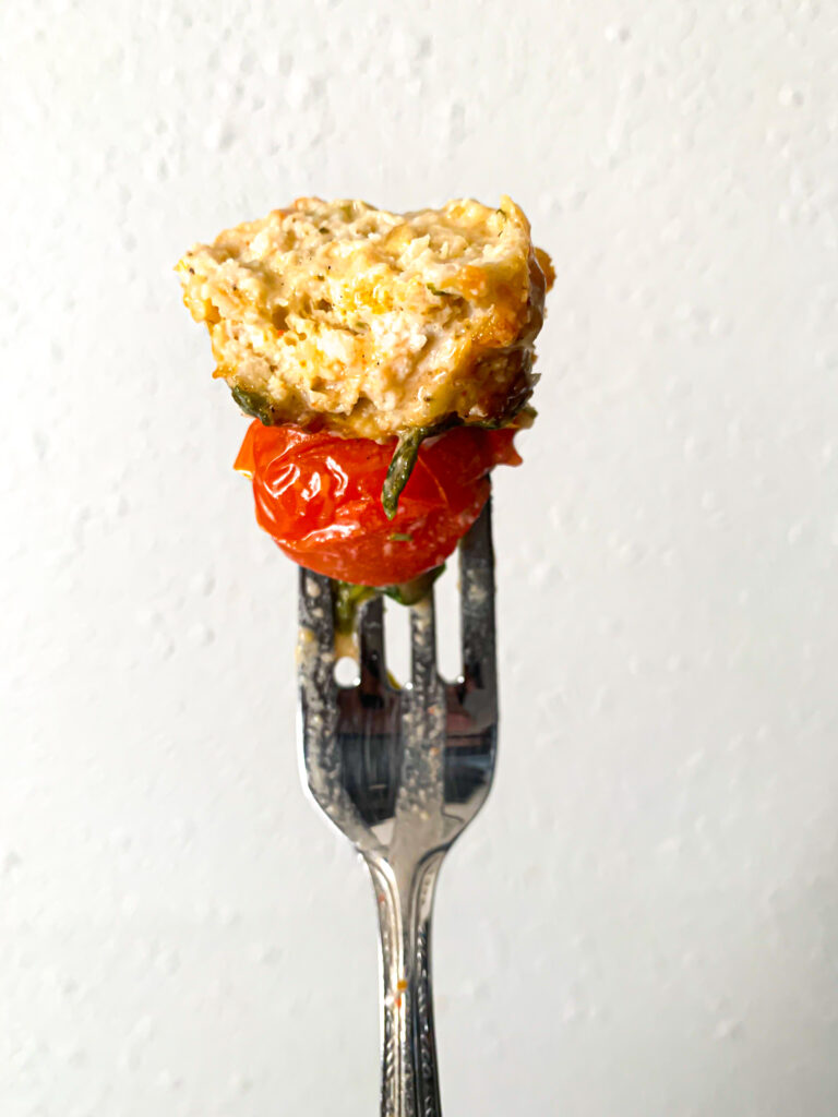 chicken meatball on fork with tomato