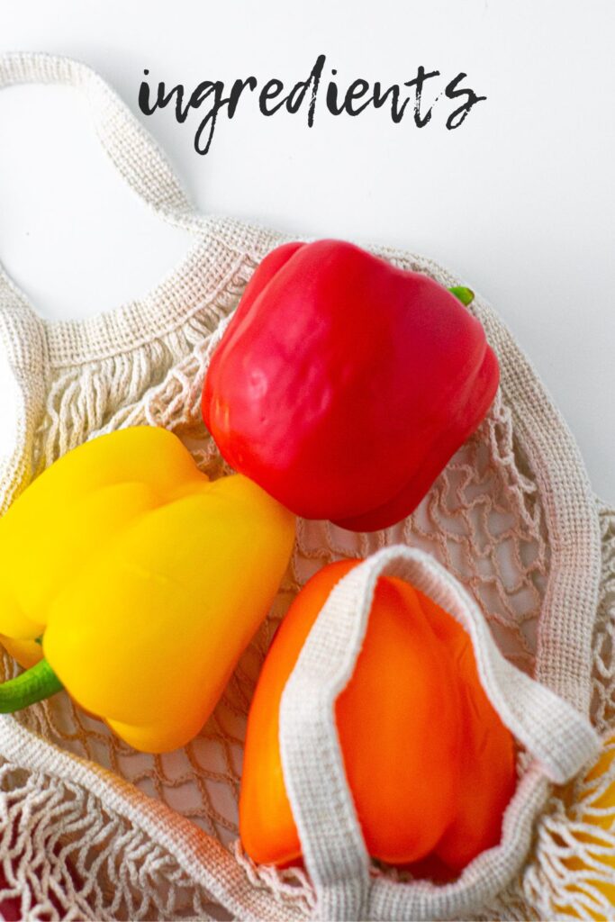 Red, yellow, and orange bell pepper in a tan produce bag.